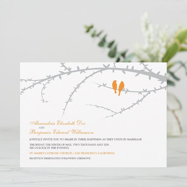 Elegant wedding invitation with bird illustration.