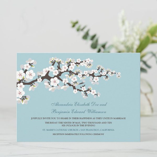 Wedding invitation featuring floral branch design.