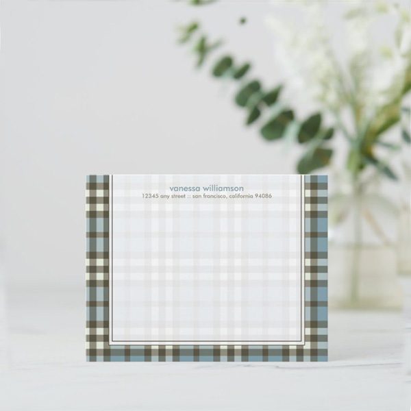 Plaid stationery card with personalized details.